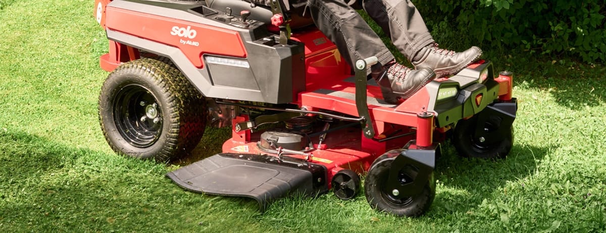 A Solo by AL-KO zero-turn ride-on mower on a garden lawn