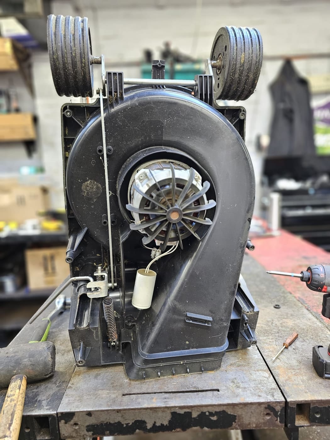 A Hayter Envoy deck stood upright with the motor and wiring in place