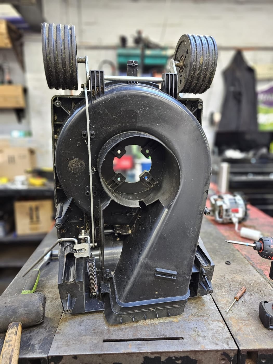 A Hayter Envoy deck with the motor removed for inspection