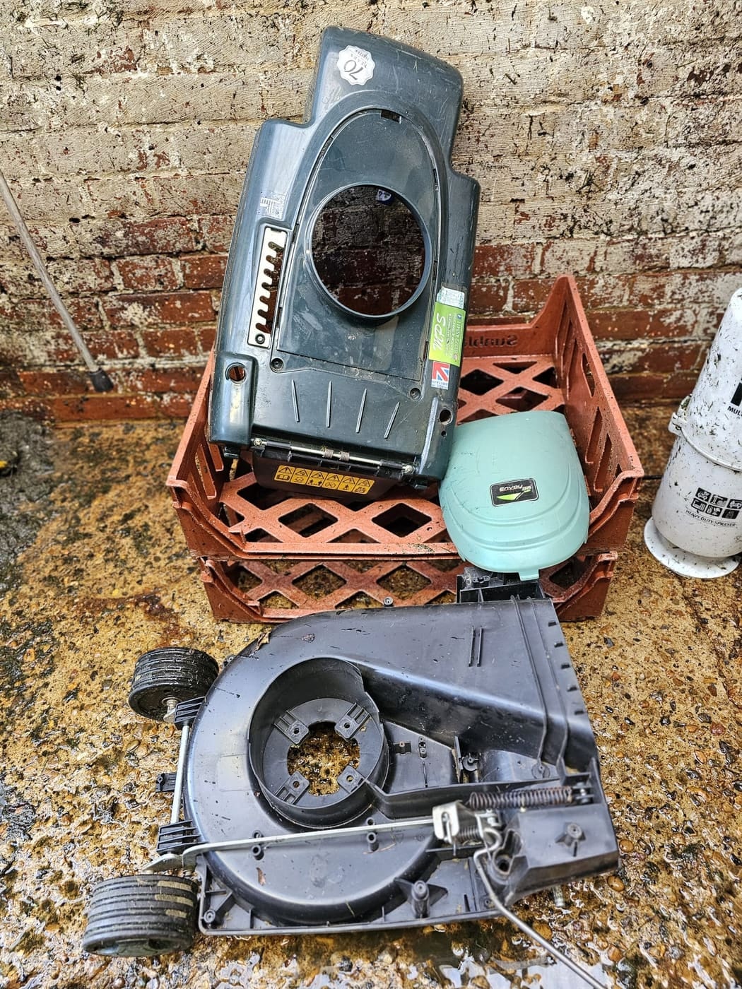 A stripped Hayter Envoy shell and deck in a crate ready for washing