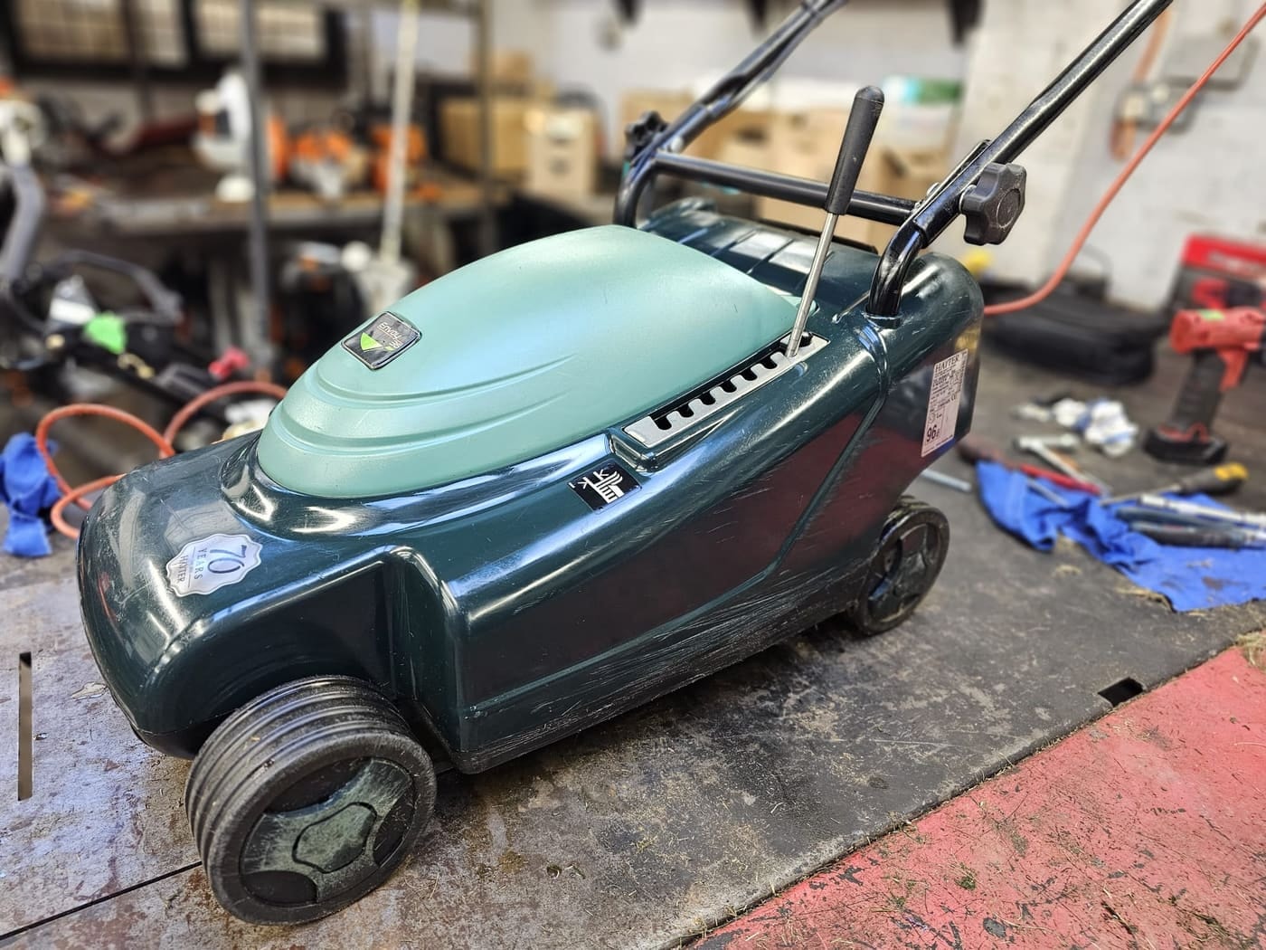 A freshly serviced Hayter Envoy mower in the MPS workshop