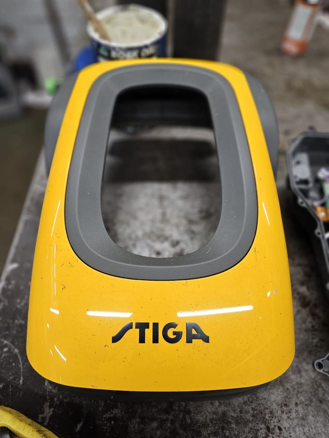 A Stiga robot mower with its top shell removed