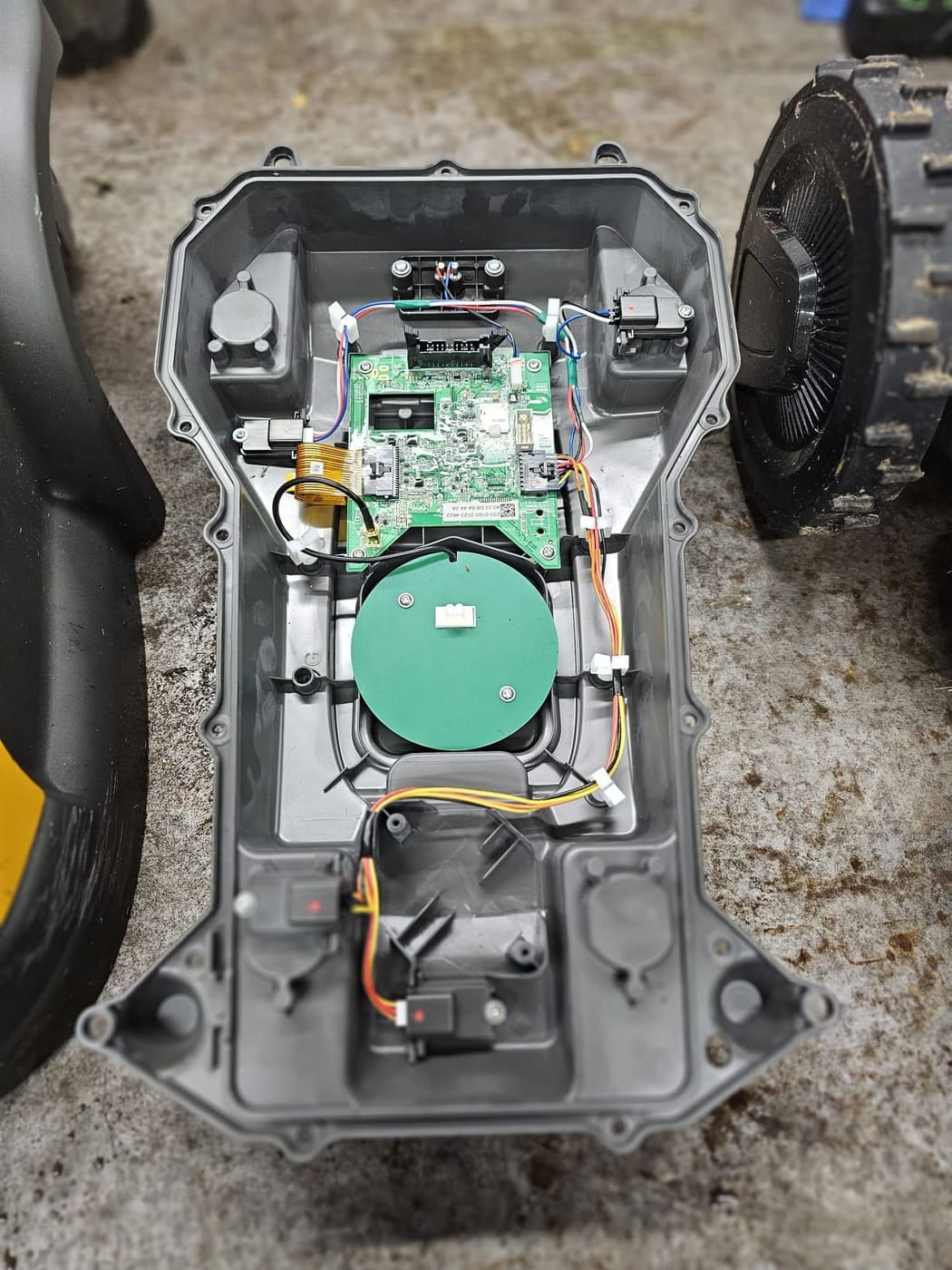 The main circuit board and sensors of a Stiga robot mower