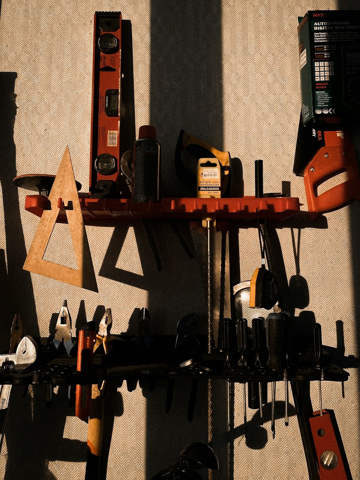 A wall of hand tools and accessories